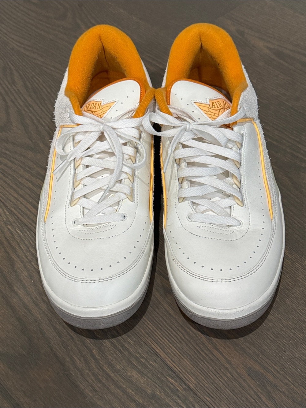 Jordan Low Top Sneakers in White and Orange Accent